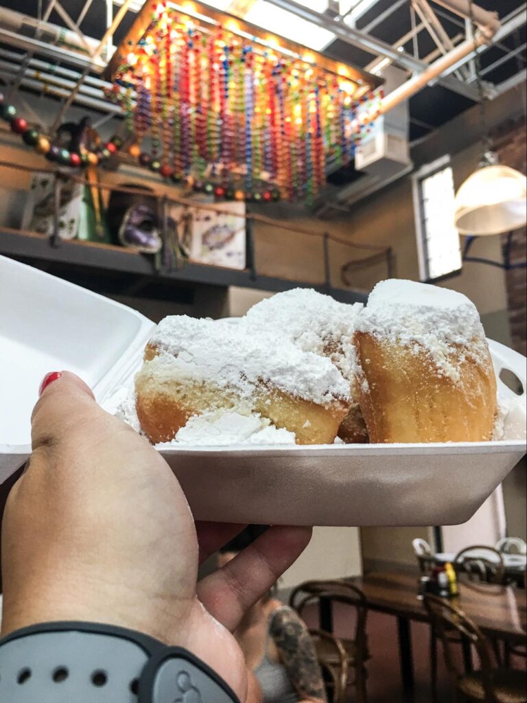 Beignets topped with powdered sugar.