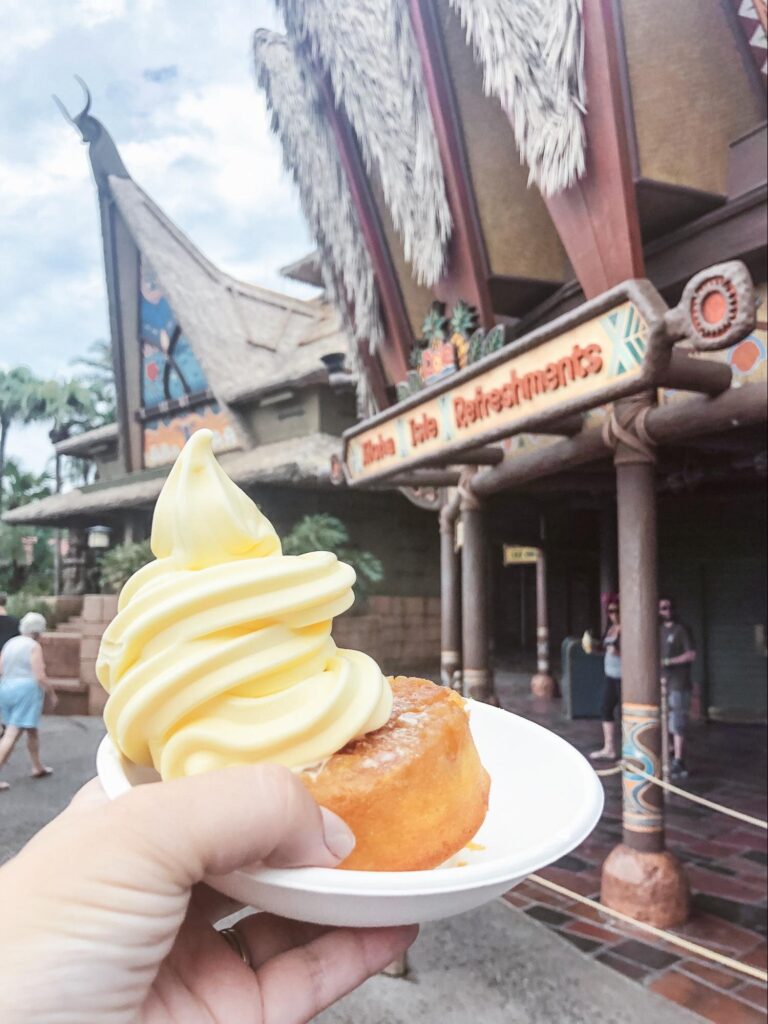 Dole whip on top of a small yellow cake.