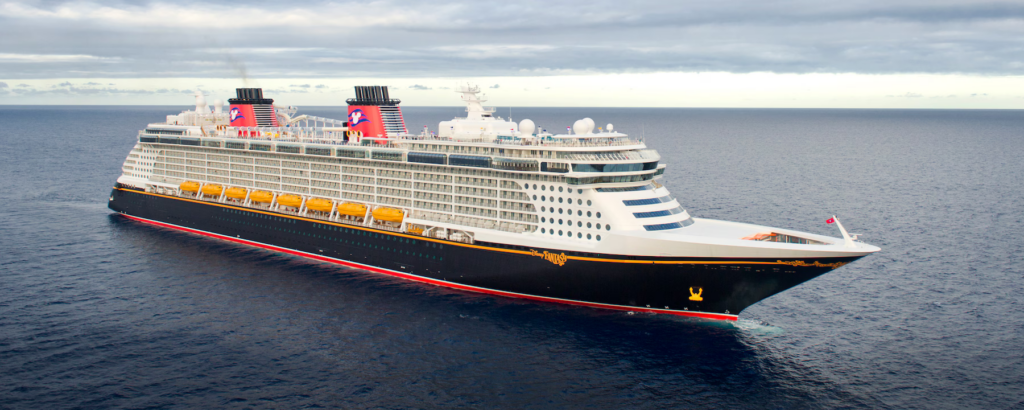 white, black, and red image of Disney Fantasy ship on water