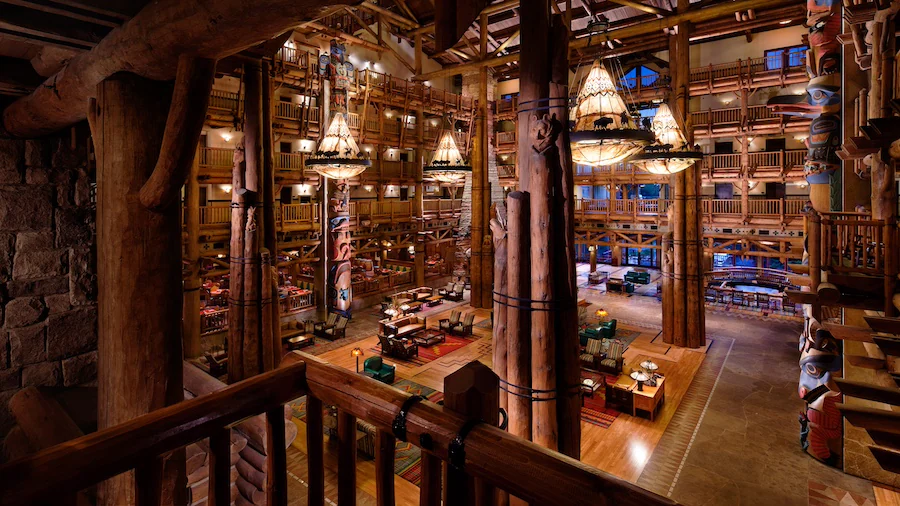 The lobby of Disney's Wilderness Lodge, a large, multi-story room resembling the interior of a log cabin.